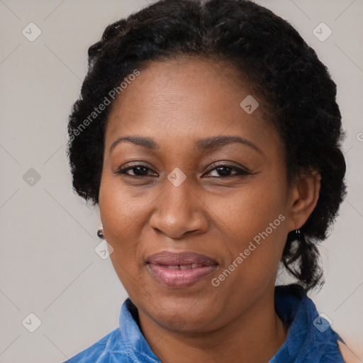 Joyful black adult female with short  brown hair and brown eyes