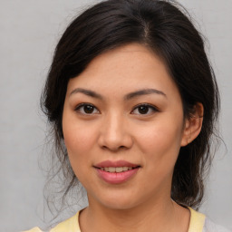 Joyful asian young-adult female with medium  brown hair and brown eyes