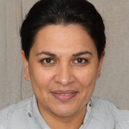 Joyful white adult female with short  brown hair and brown eyes