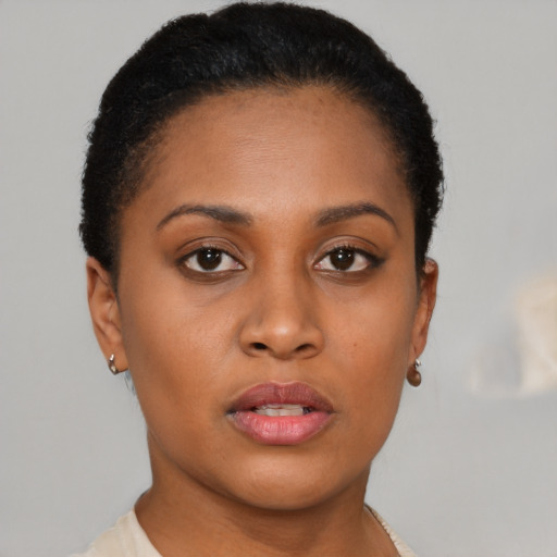 Neutral black young-adult female with short  brown hair and brown eyes