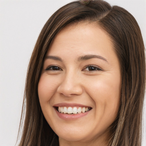 Joyful white young-adult female with long  brown hair and brown eyes