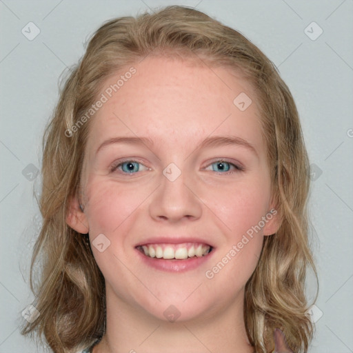 Joyful white young-adult female with medium  brown hair and blue eyes