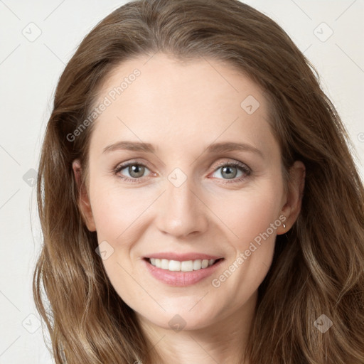 Joyful white young-adult female with long  brown hair and blue eyes