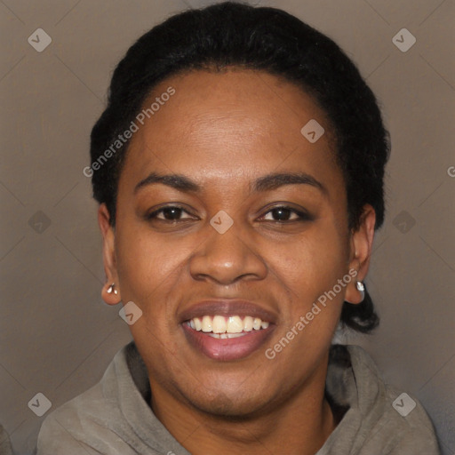 Joyful black young-adult female with short  black hair and brown eyes