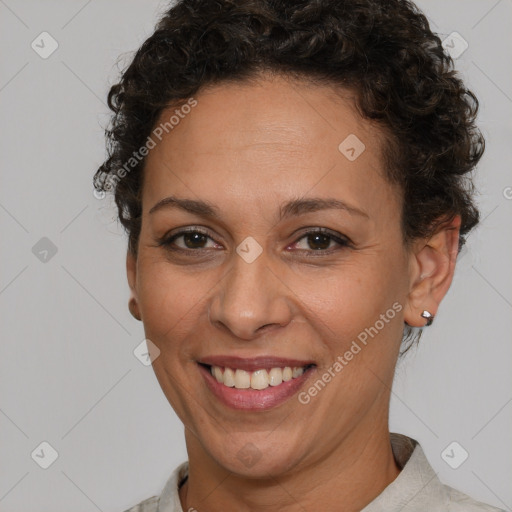 Joyful white adult female with short  brown hair and brown eyes