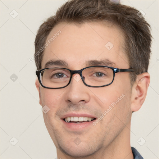 Joyful white adult male with short  brown hair and grey eyes