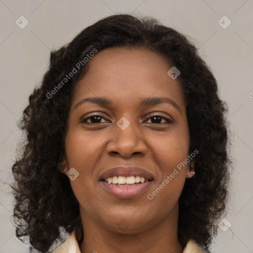 Joyful black young-adult female with medium  brown hair and brown eyes