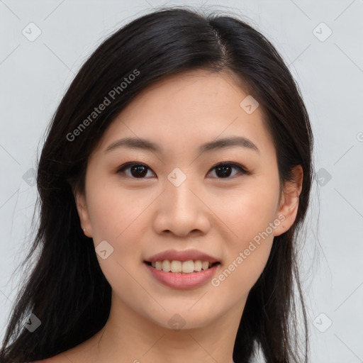 Joyful asian young-adult female with long  brown hair and brown eyes