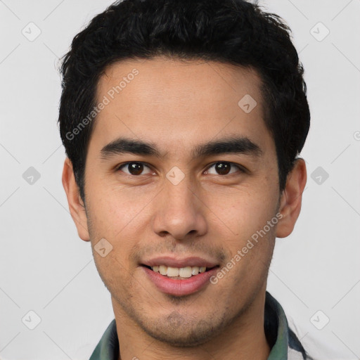 Joyful latino young-adult male with short  brown hair and brown eyes