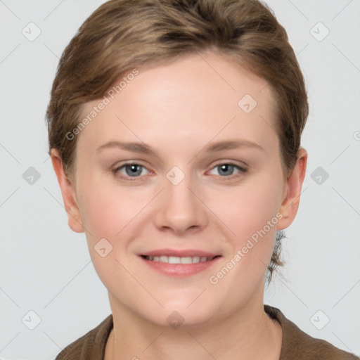 Joyful white young-adult female with short  brown hair and grey eyes