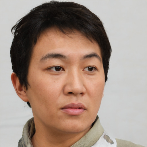 Neutral asian young-adult male with short  brown hair and brown eyes