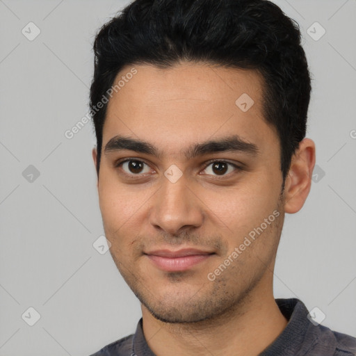 Joyful latino young-adult male with short  black hair and brown eyes