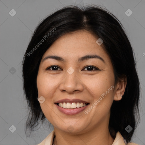 Joyful asian young-adult female with medium  black hair and brown eyes