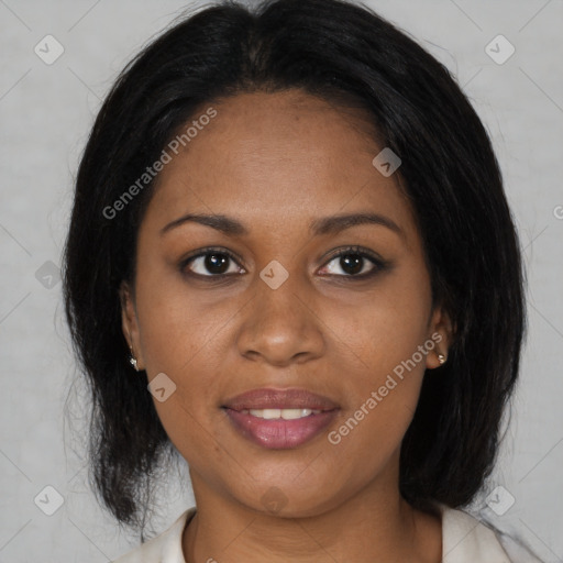 Joyful black adult female with medium  brown hair and brown eyes
