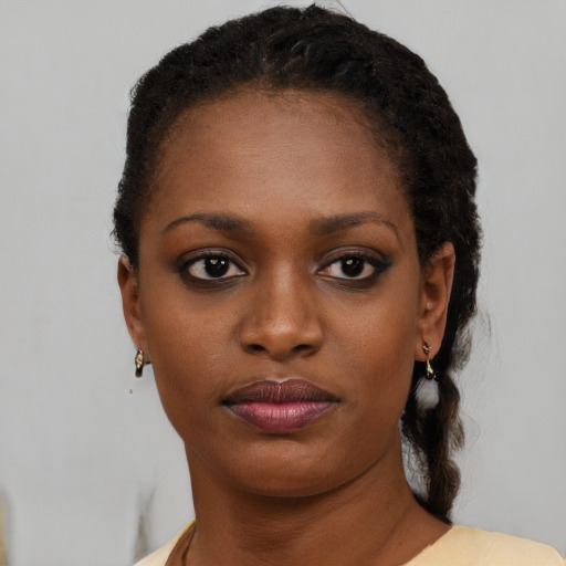 Neutral black young-adult female with short  black hair and brown eyes