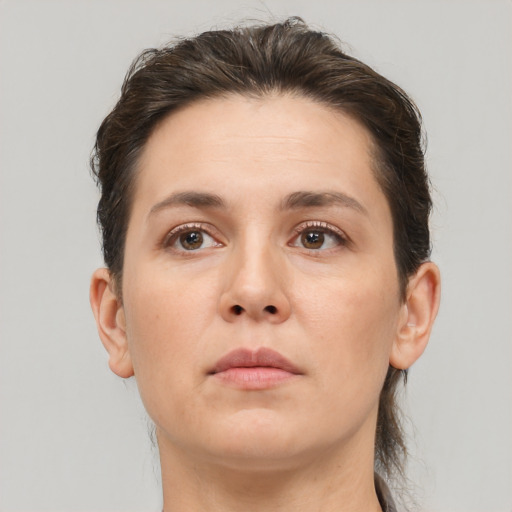 Neutral white young-adult female with short  brown hair and brown eyes