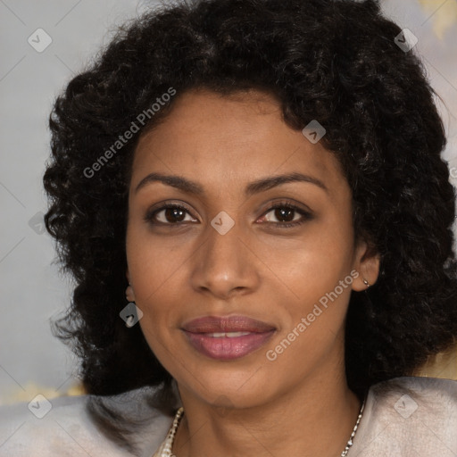 Joyful black young-adult female with long  brown hair and brown eyes