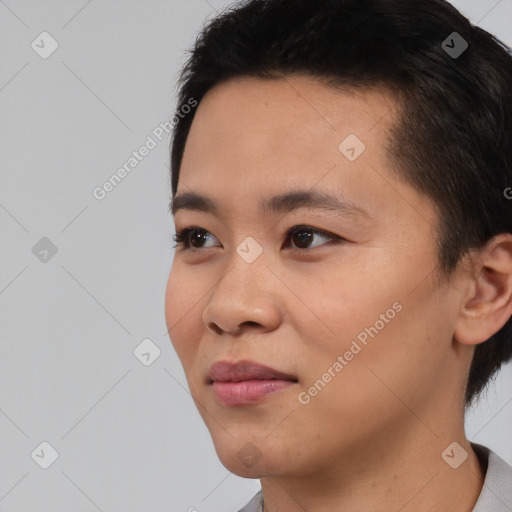 Joyful asian young-adult female with short  black hair and brown eyes