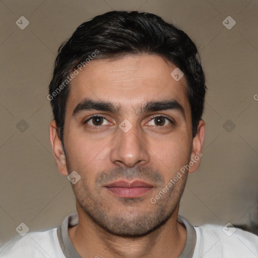 Joyful white young-adult male with short  black hair and brown eyes