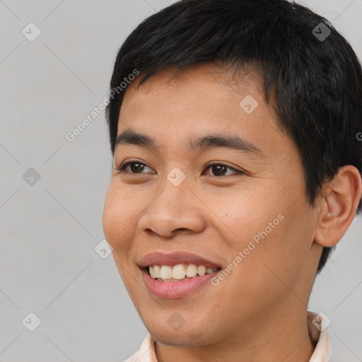 Joyful asian young-adult male with short  brown hair and brown eyes