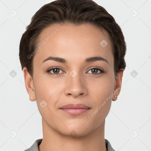 Joyful white young-adult female with short  brown hair and brown eyes