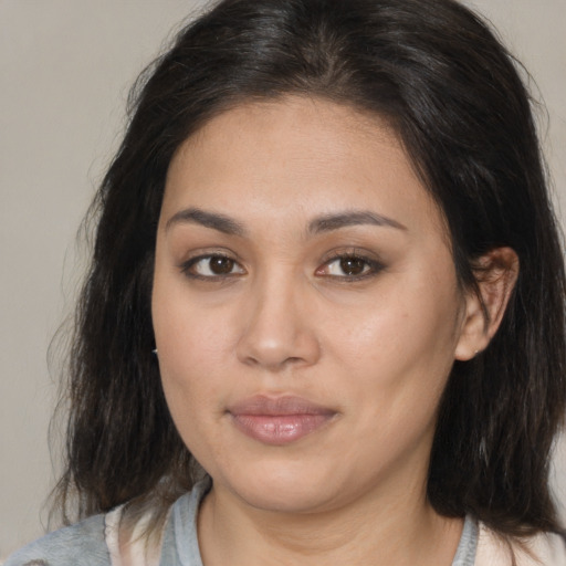 Joyful asian young-adult female with medium  brown hair and brown eyes