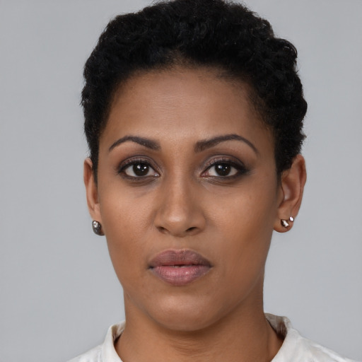 Neutral black young-adult female with short  black hair and brown eyes