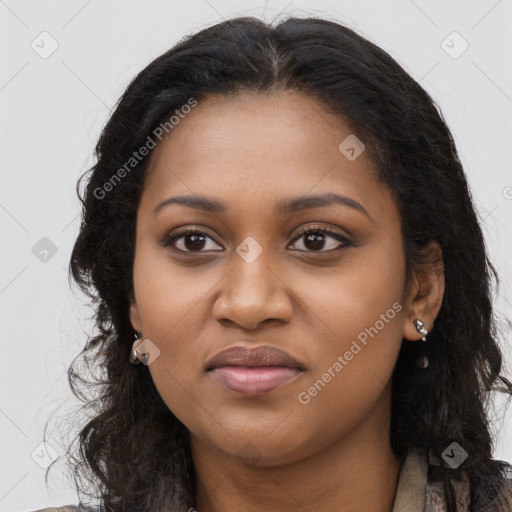 Joyful black young-adult female with long  brown hair and brown eyes