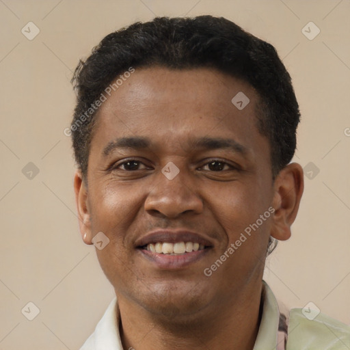 Joyful latino young-adult male with short  black hair and brown eyes