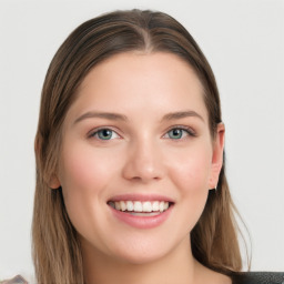 Joyful white young-adult female with long  brown hair and blue eyes