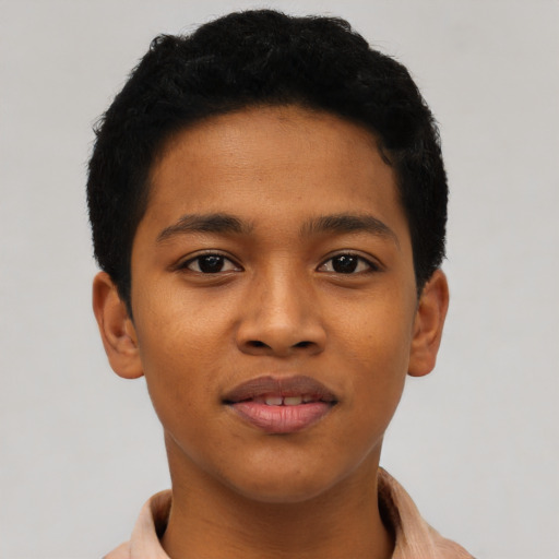 Joyful latino young-adult male with short  brown hair and brown eyes