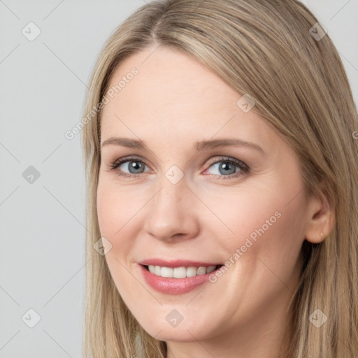 Joyful white young-adult female with long  brown hair and grey eyes