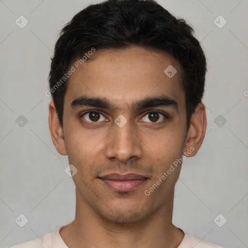 Joyful latino young-adult male with short  brown hair and brown eyes