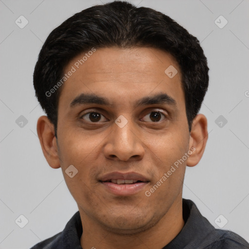 Joyful latino young-adult male with short  black hair and brown eyes