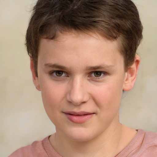 Joyful white child male with short  brown hair and grey eyes