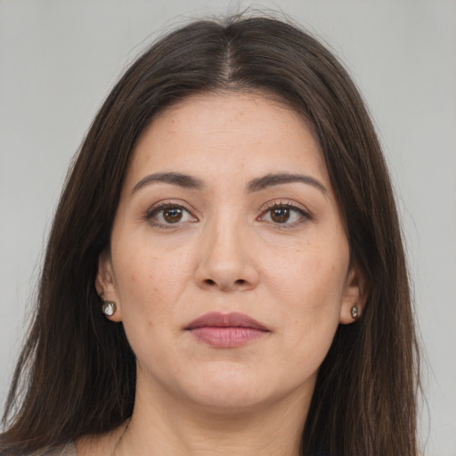 Neutral white young-adult female with long  brown hair and brown eyes