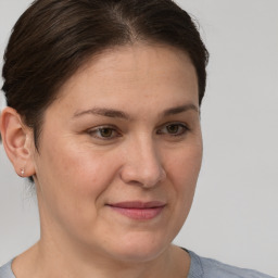 Joyful white adult female with short  brown hair and brown eyes