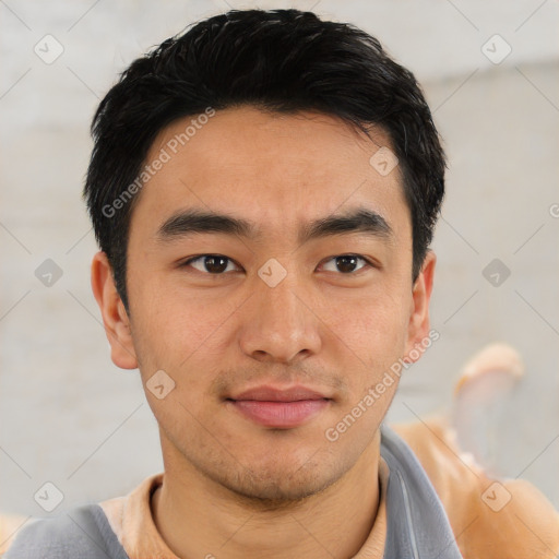 Joyful asian young-adult male with short  black hair and brown eyes