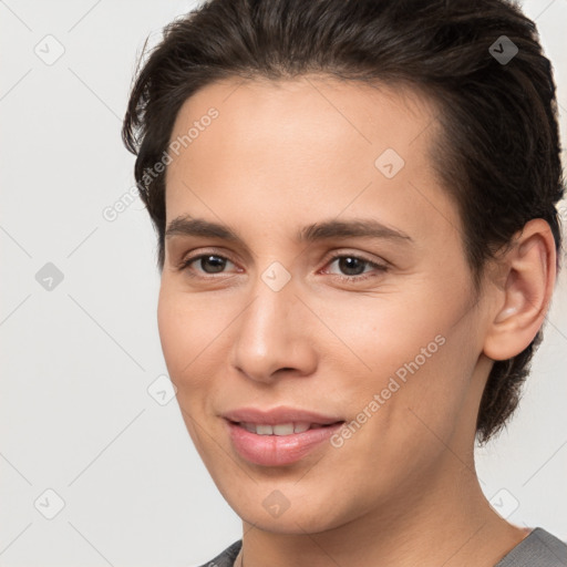 Joyful white young-adult female with short  brown hair and brown eyes