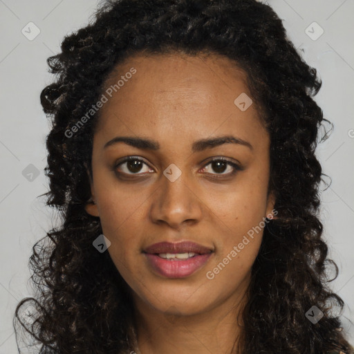 Joyful black young-adult female with long  brown hair and brown eyes