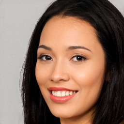 Joyful white young-adult female with long  black hair and brown eyes