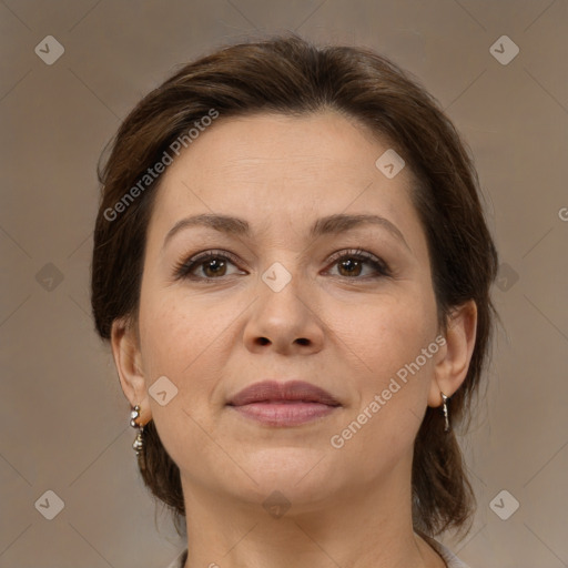 Joyful white adult female with medium  brown hair and brown eyes