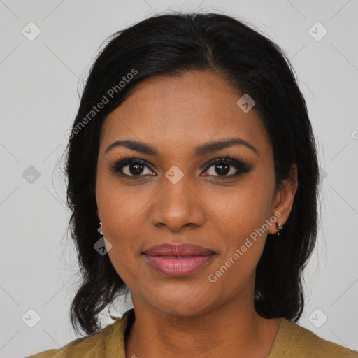 Joyful black young-adult female with long  black hair and brown eyes