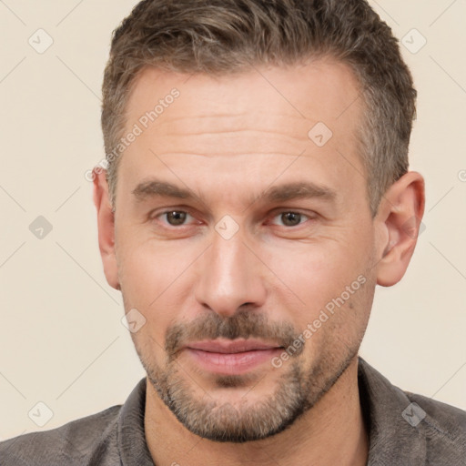 Joyful white adult male with short  brown hair and brown eyes