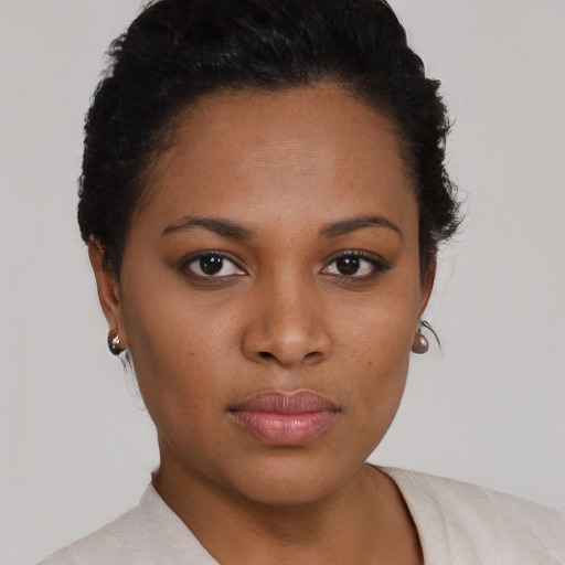 Neutral black young-adult female with short  brown hair and brown eyes