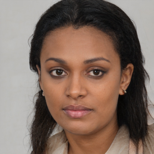 Neutral black young-adult female with long  brown hair and brown eyes