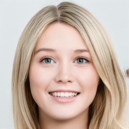 Joyful white young-adult female with long  brown hair and blue eyes