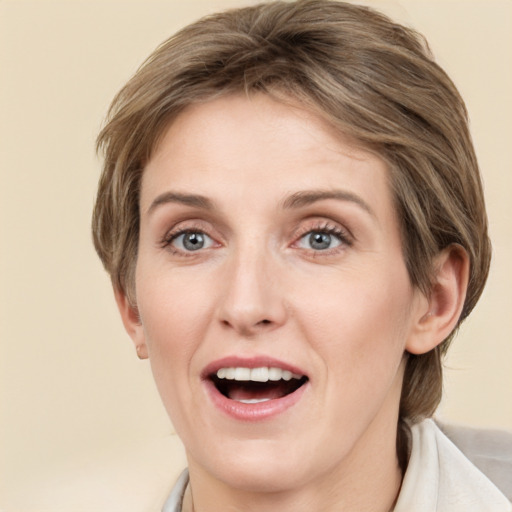 Joyful white young-adult female with medium  brown hair and grey eyes