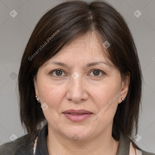 Joyful white adult female with medium  brown hair and brown eyes