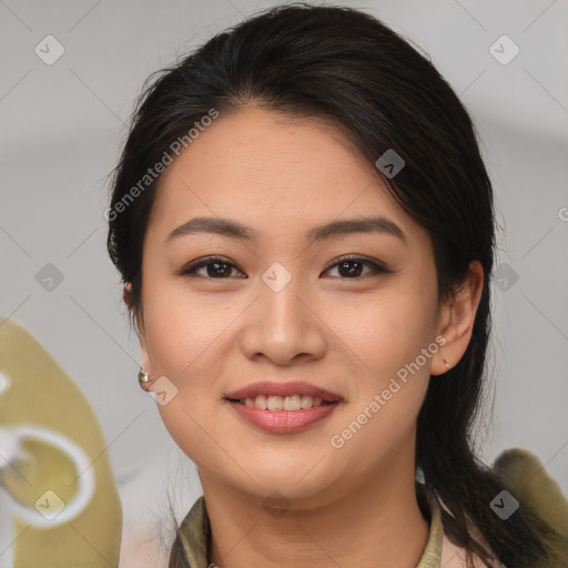 Joyful latino young-adult female with medium  brown hair and brown eyes